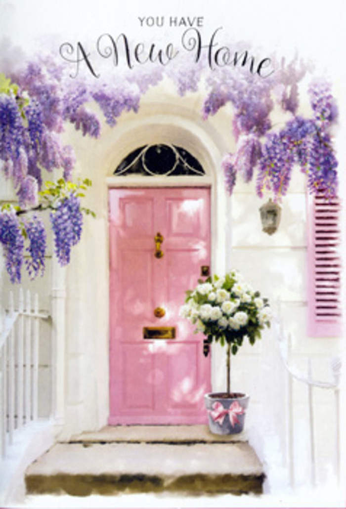 The photograph presents a beautifully composed doorway that would not feel out of place in the elegant backstreets of St James's, where old stone and carefully chosen colours come together with quiet confidence. A soft pink front door, painted in a matte, almost chalk-like finish, stands proudly in the middle of the frame, its paneling subtly catching the light. The surrounding walls are whitewashed and smooth, reflecting a gentle, late-afternoon glow that makes the pink appear even warmer. Cloaking the top of the doorway, luxuriant wisteria trails in abundant cascades, the blossoms a harmonious mix of lavender and pale lilac, some florets edging towards creamy white at their tips. These hanging garlands create a natural arch, forming a floral canopy that seems to cradle the entrance, as though nature itself is offering a gracious welcome. To the side, a shutter painted in a matching blush hue echoes the door and helps to balance the pastel palette. Set on the doorstep is a simple grey metal bucket pressed into service as a vessel for flowers, suggesting the hand of an experienced florist in St James's. Inside it, plush white and cream roses are packed generously, each bloom full and velvety, their petals unfolding in soft spirals. Delicate stems of muted green foliage nestle between the roses, adding texture and depth without disturbing the calm, neutral scheme. A satin pink ribbon encircles the bucket and is tied in a perfectly judged bow, its sheen catching small glimmers of light filtering through the wisteria above. The interplay of shadow and illumination across the step and door creates a tranquil, expectant mood, as though this arrangement has been placed to greet someone arriving at their new home nearby. It speaks quietly of housewarmings, new keys in hand, and the reassurance that, even in the heart of the city, flowers can instantly transform a doorway into a sanctuary.