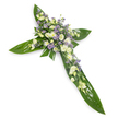 A solemn, elegant cross crafted from broad, glossy tropical leaves set against a clean white background and photographed from a slight overhead angle. The structural form of the Christian cross is assembled from large green Ti-style leaves whose smooth, reflective surfaces and visible veins create a verdant, architectural base. At the intersection and running along the horizontal and vertical arms, clusters of soft white and creamy ivory blooms are densely arranged to draw the eye to the centre. Plush, ruffled lisianthus in pale ivory unfurl with layered petals and occasional tight buds, while small white spray chrysanthemums or miniature-style blooms mingle among them to add brightness and gentle texture. Interspersed through the white masses are delicate sprays of powdery lavender and pale purple accent flowers-tiny star-shaped limonium or aster-like blooms-that introduce a quiet cool contrast and subtle depth. Finer green filler foliage is woven through the floral clusters, softening edges and enhancing the natural, handheld quality of the tribute. The lighting is even and gentle, highlighting the sheen on the leaves and the soft translucence of petals, while a faint, green-tinged scent might be imagined-clean, fresh, and unobtrusive. This composition reads as a dignified sympathy piece, suitable for funeral services, memorials, and church ceremonies in and around St James's, where friends and family often gather to remember a life. The overall effect is one of restrained grace and consolation: a visual expression of reverence, hope, and enduring peace that speaks quietly yet clearly to those offering condolences.